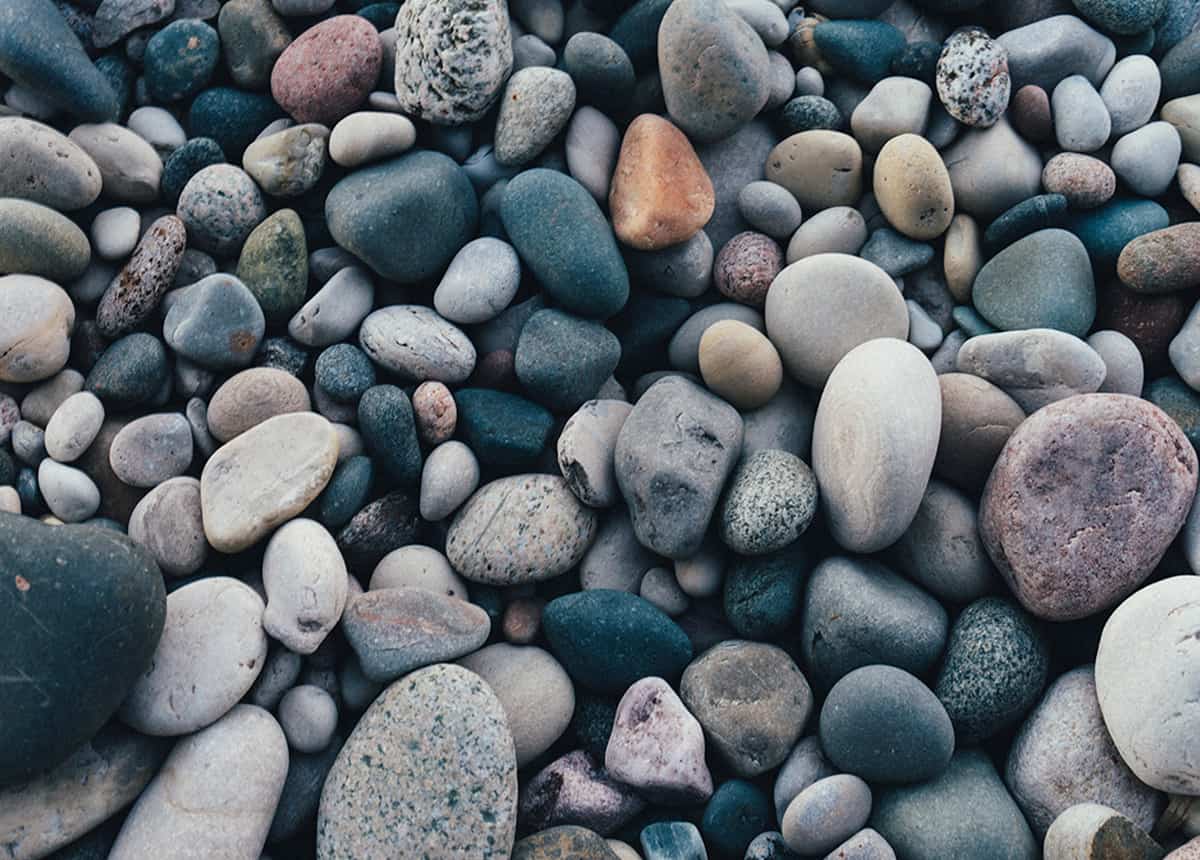 Close-up image of various colored stones and pebbles.